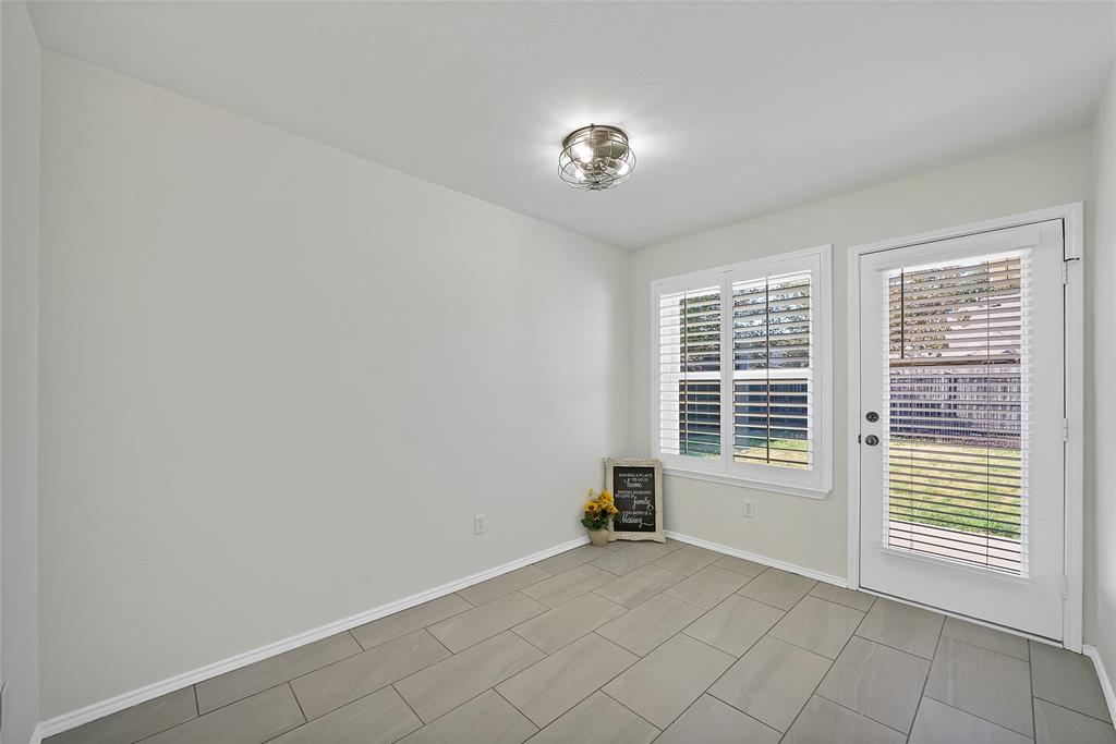 308 South Chestnut Street Forney, TX 75126 - Photo 10 of 25 a view of an empty room with a window