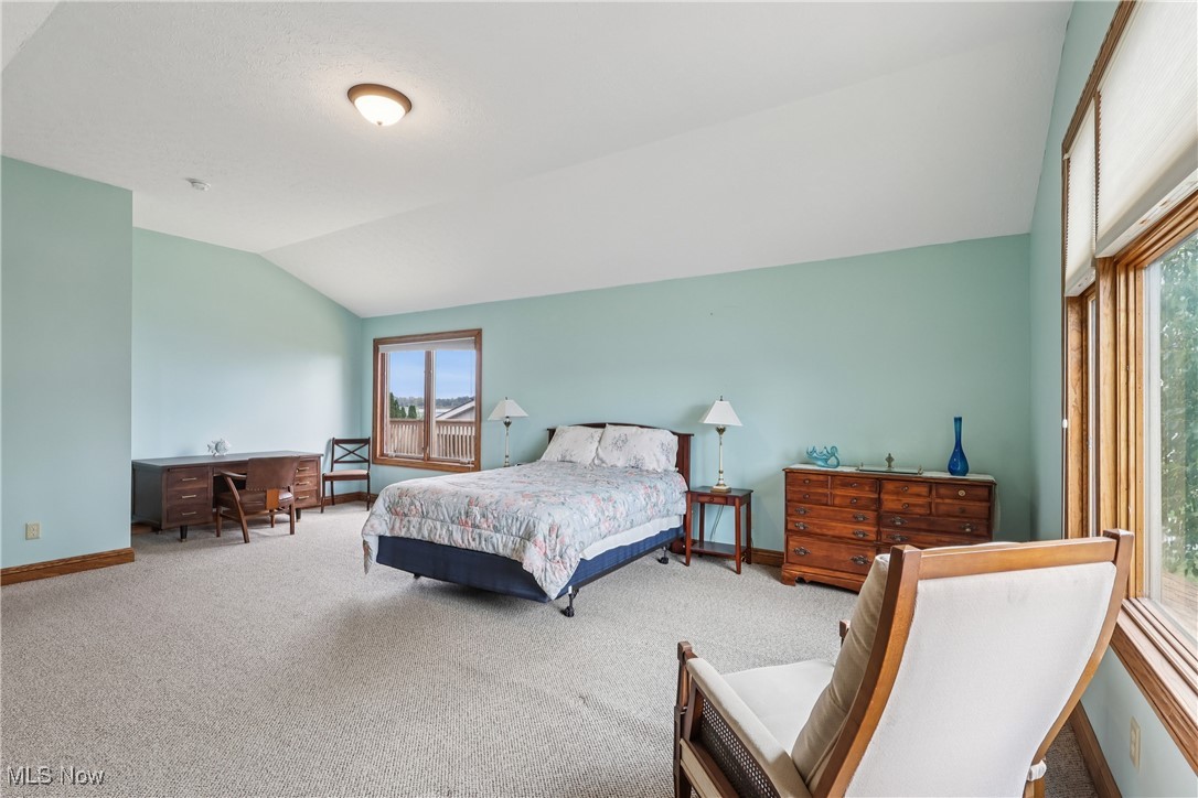 337 Cedar Point Road Sandusky, OH 44870 - Photo 22 of 50 Carpeted bedroom featuring lofted ceiling and an office area