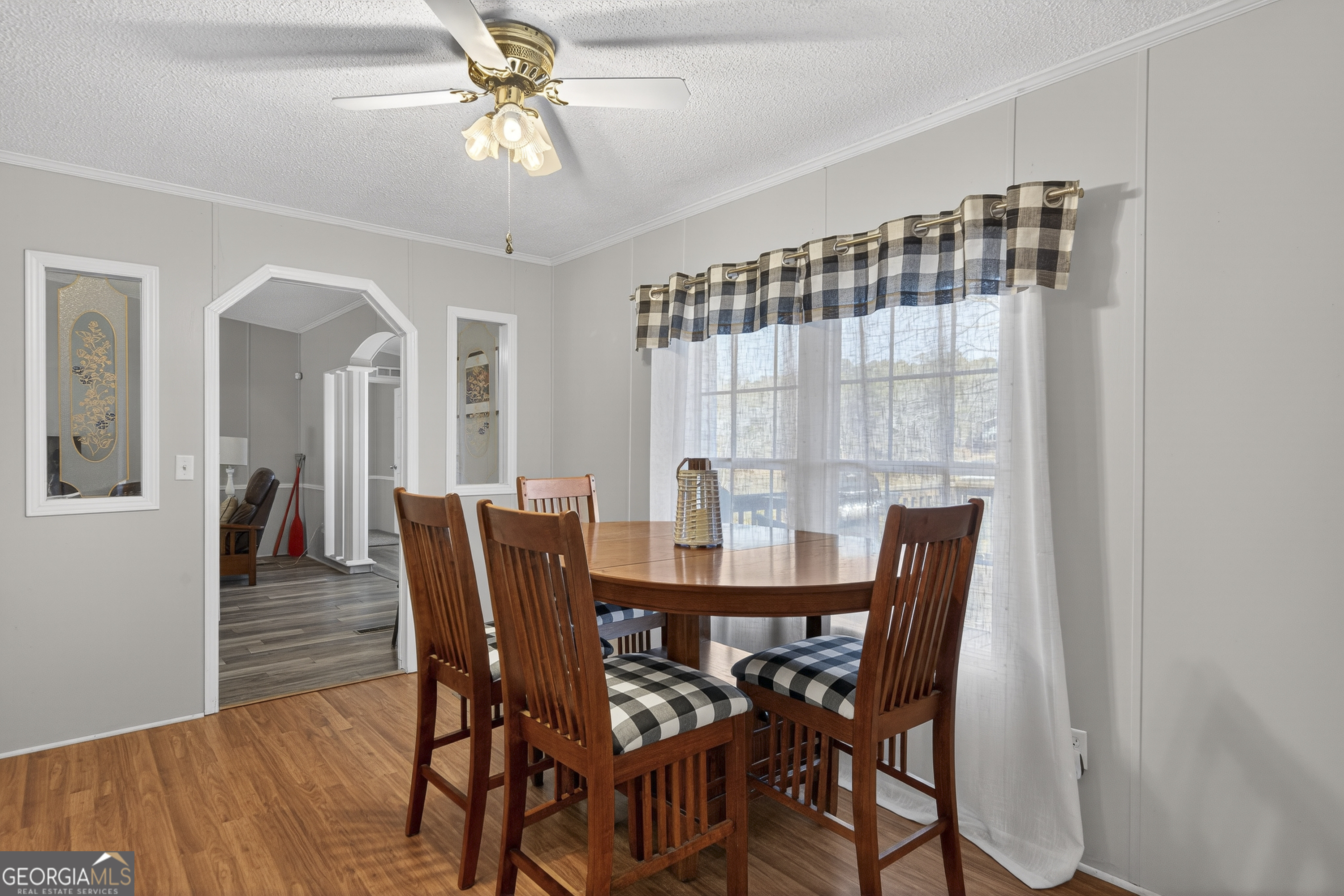 392 Hub Dent Road Northeast Milledgeville, GA 31061 - Photo 24 of 66 a view of a dining room with furniture and wooden floor