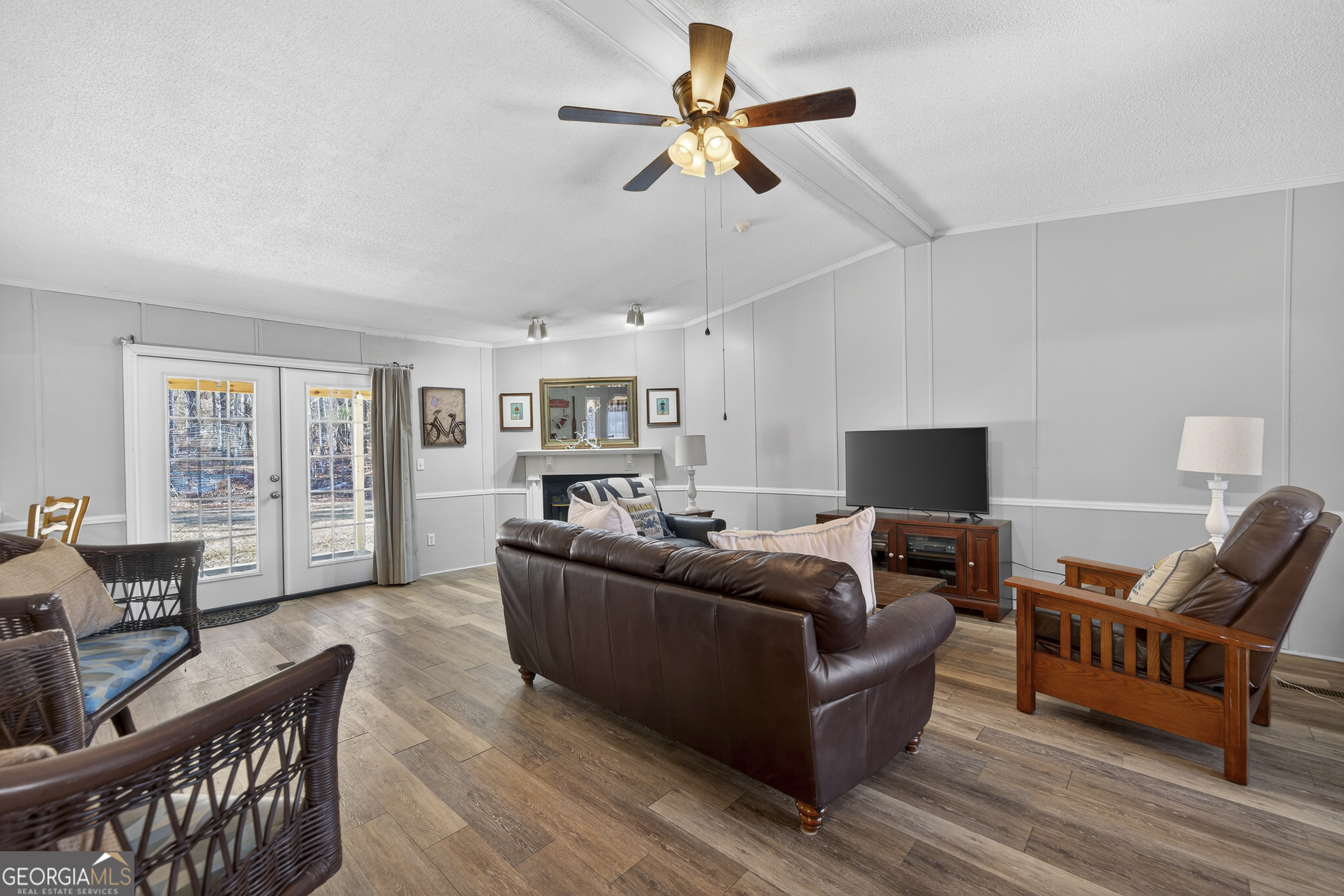 392 Hub Dent Road Northeast Milledgeville, GA 31061 - Photo 26 of 66 a living room with furniture and a flat screen tv
