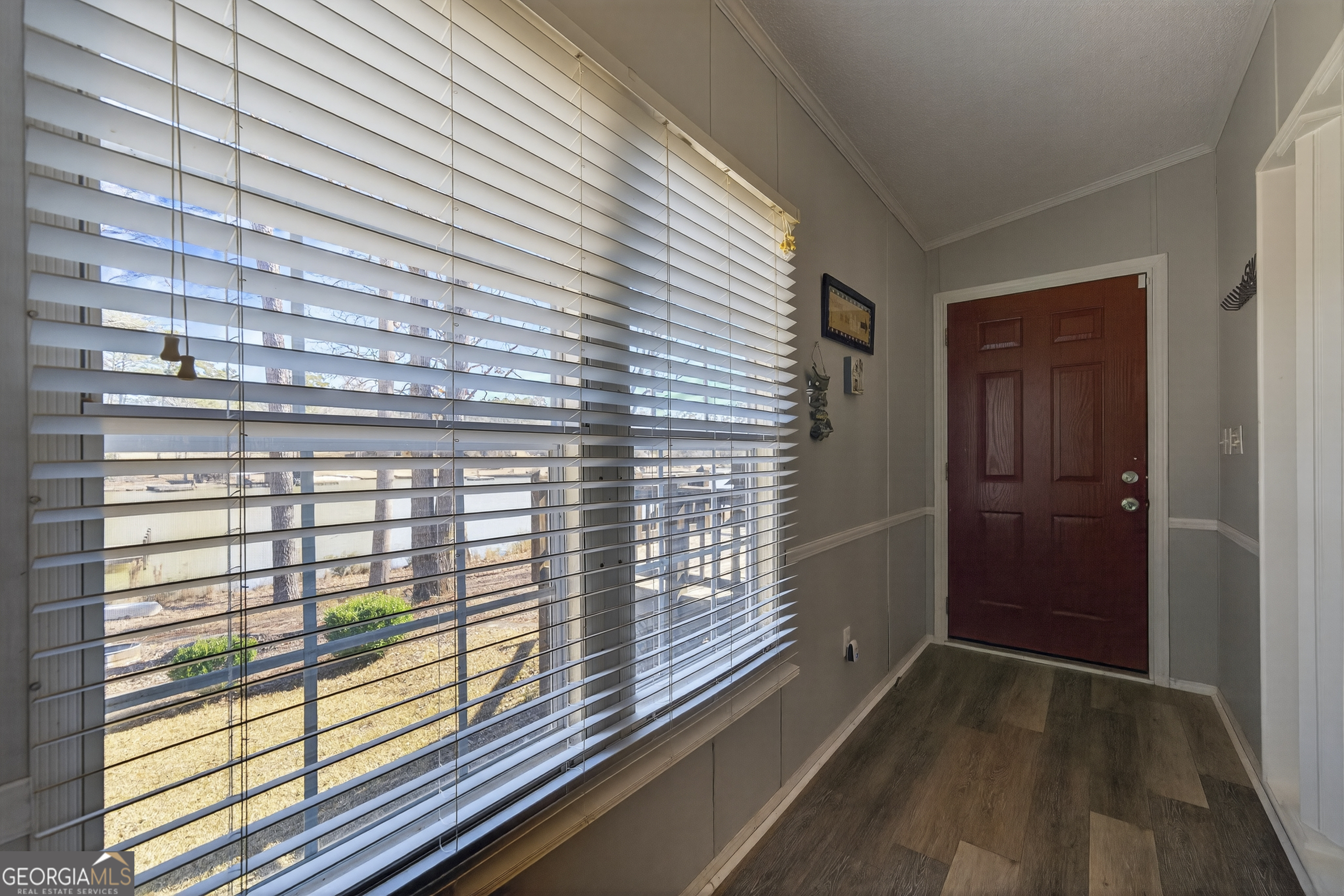 392 Hub Dent Road Northeast Milledgeville, GA 31061 - Photo 33 of 66 a view of balcony with wooden floor
