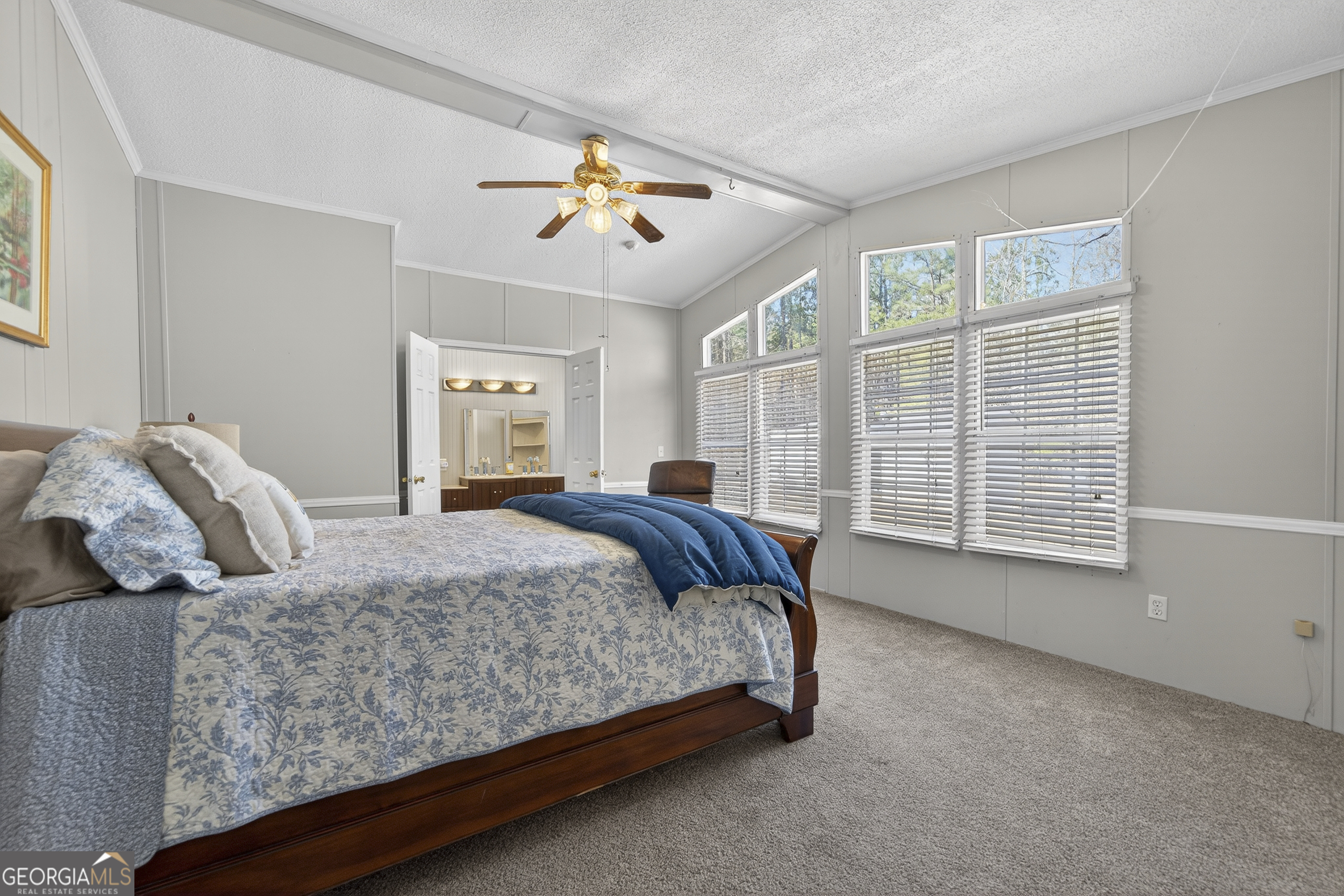 392 Hub Dent Road Northeast Milledgeville, GA 31061 - Photo 35 of 66 a bedroom with a large bed and a window