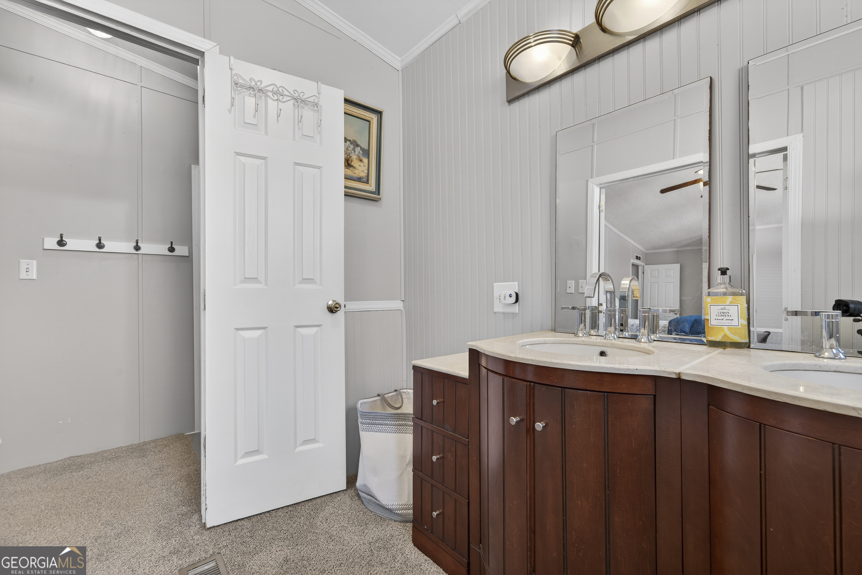 392 Hub Dent Road Northeast Milledgeville, GA 31061 - Photo 40 of 66 a bathroom with a double vanity sink and mirror