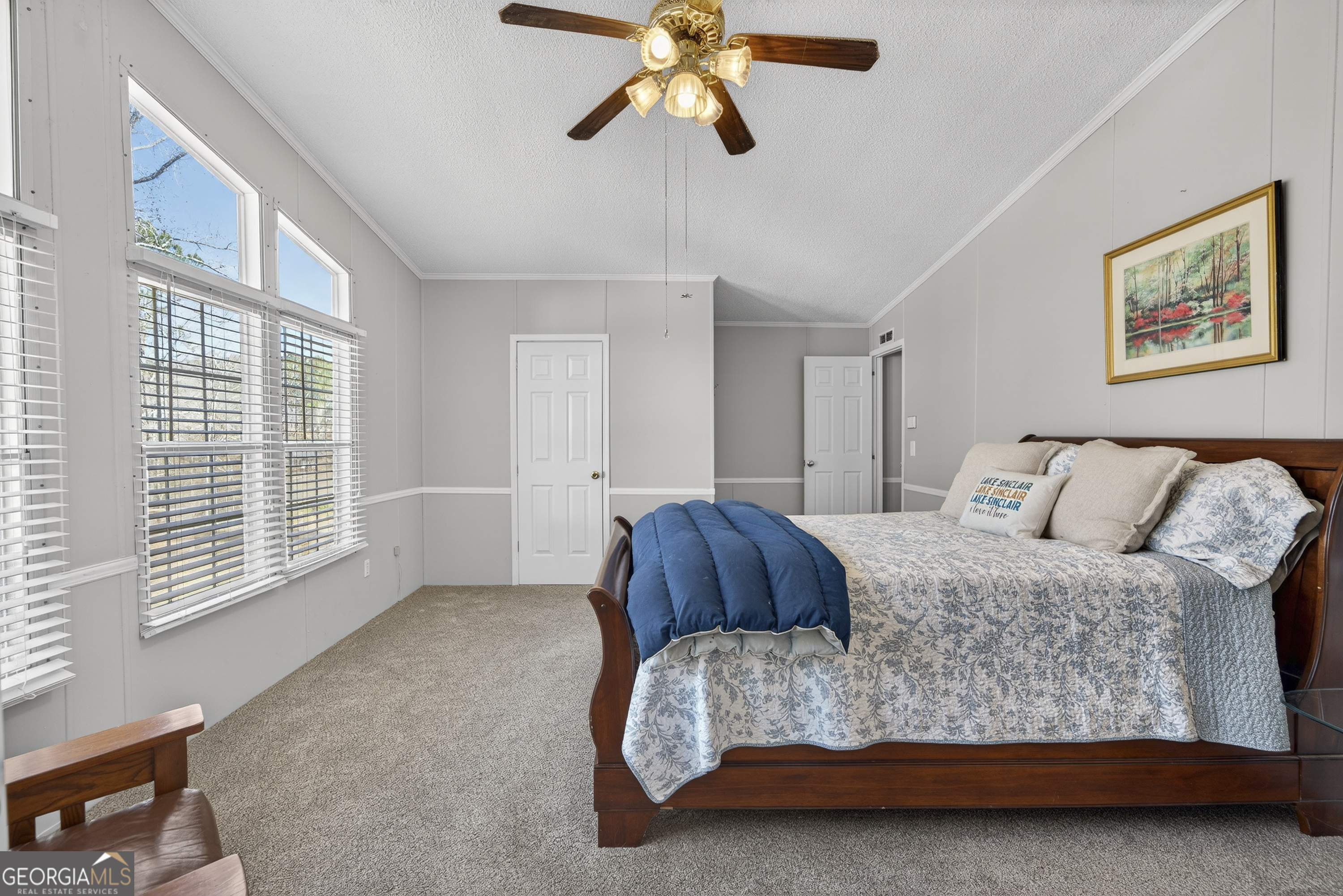 392 Hub Dent Road Northeast Milledgeville, GA 31061 - Photo 41 of 66 a bedroom with a bed and window