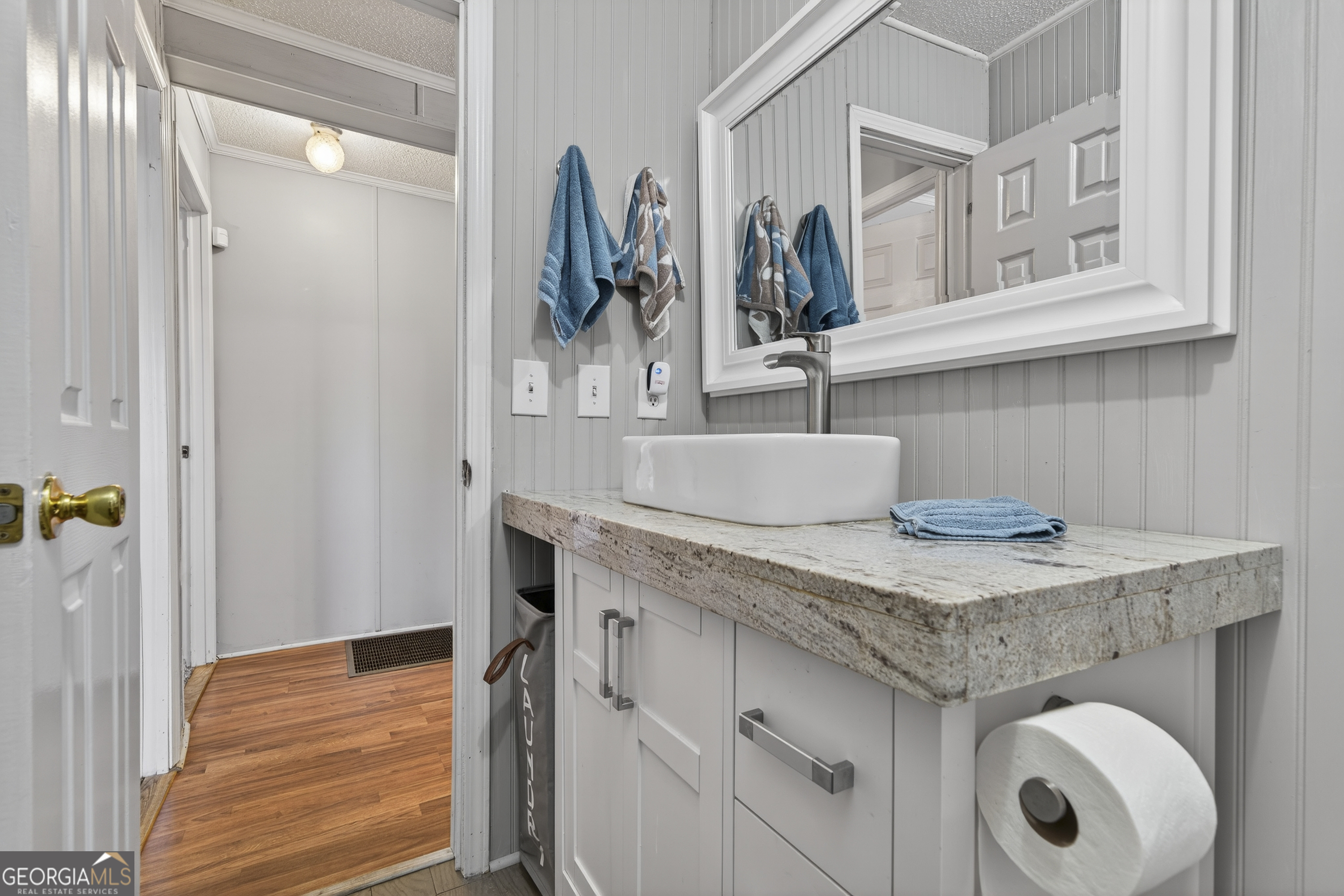 392 Hub Dent Road Northeast Milledgeville, GA 31061 - Photo 43 of 66 a kitchen with stainless steel appliances granite countertop a sink and cabinets