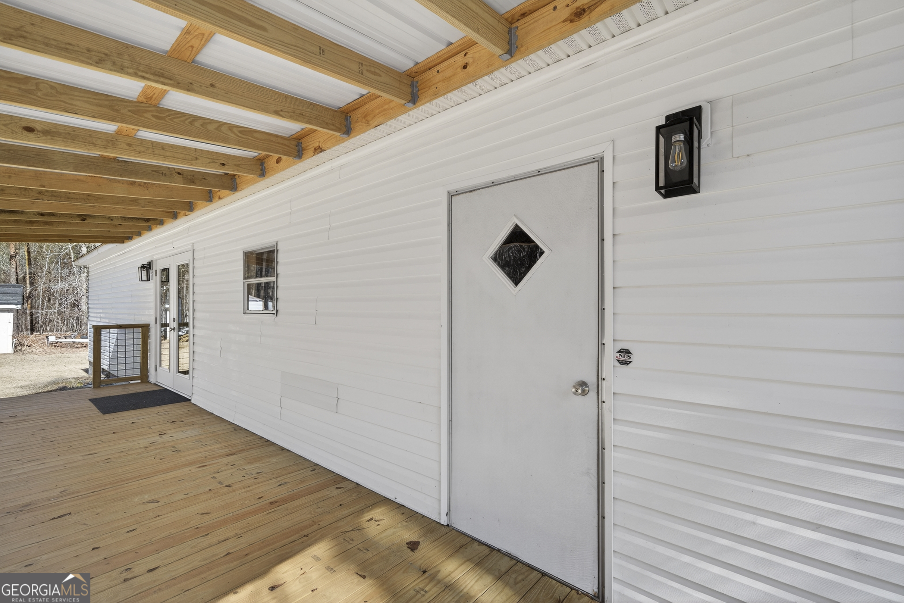 392 Hub Dent Road Northeast Milledgeville, GA 31061 - Photo 52 of 66 a view of a hallway with wooden floor