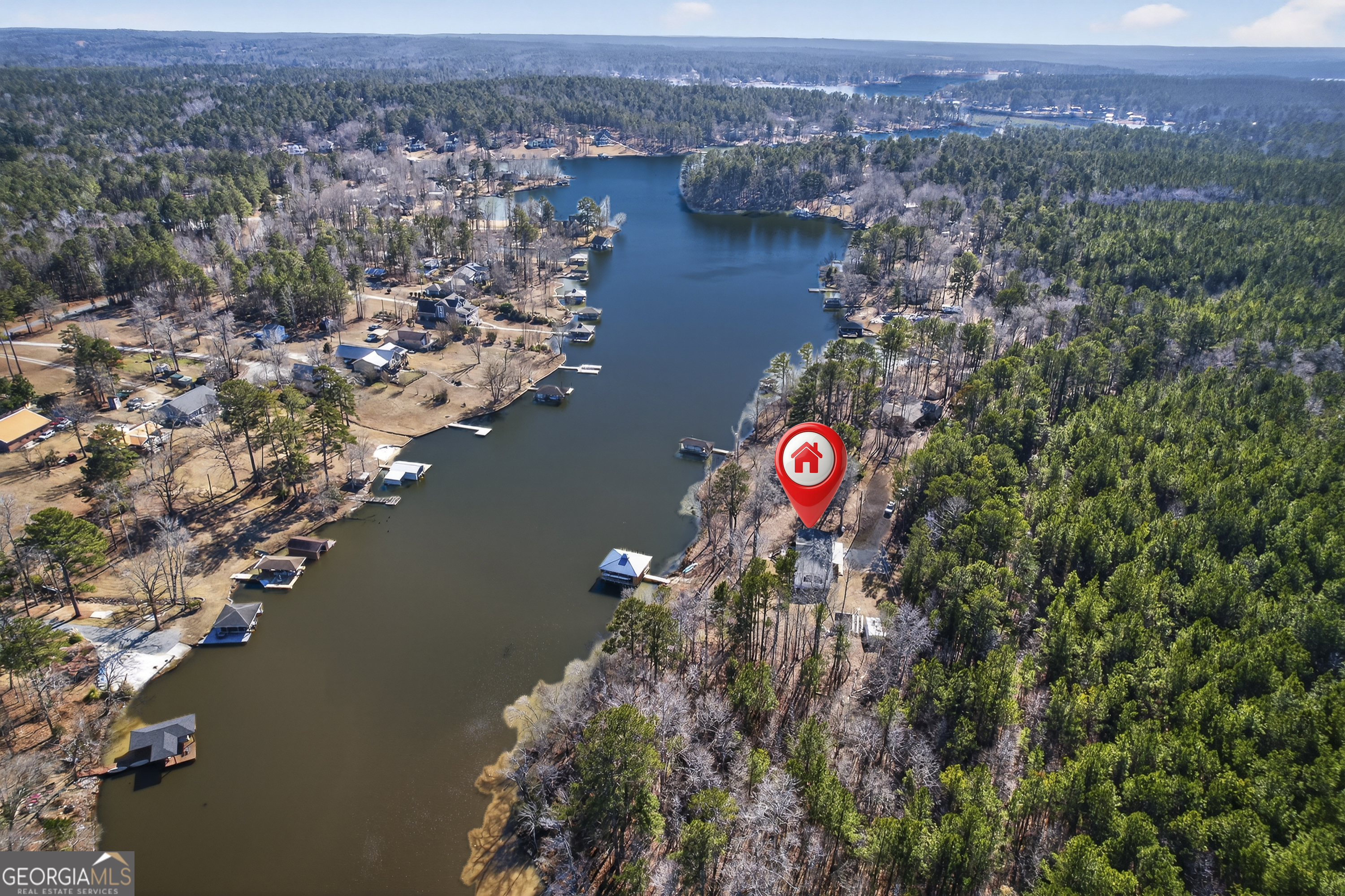 392 Hub Dent Road Northeast Milledgeville, GA 31061 - Photo 6 of 66 an aerial view of residential houses with outdoor space and lake view