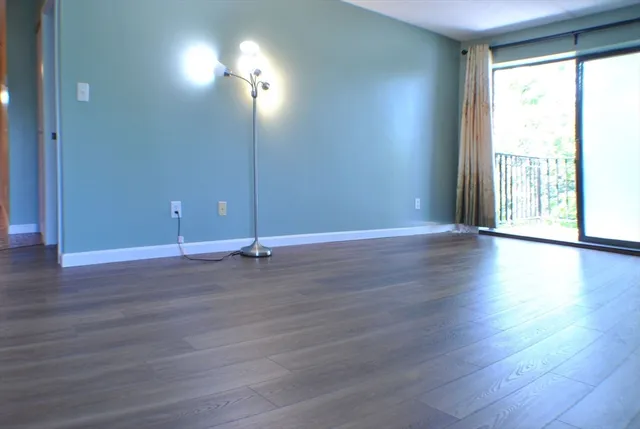 a view of a livingroom with wooden floor