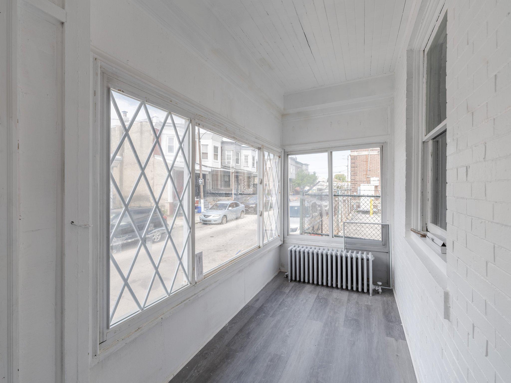 1823 South Yewdall Street Philadelphia, PA 19143 - Photo 3 of 21 Bright and airy sunroom/enclosed porch.