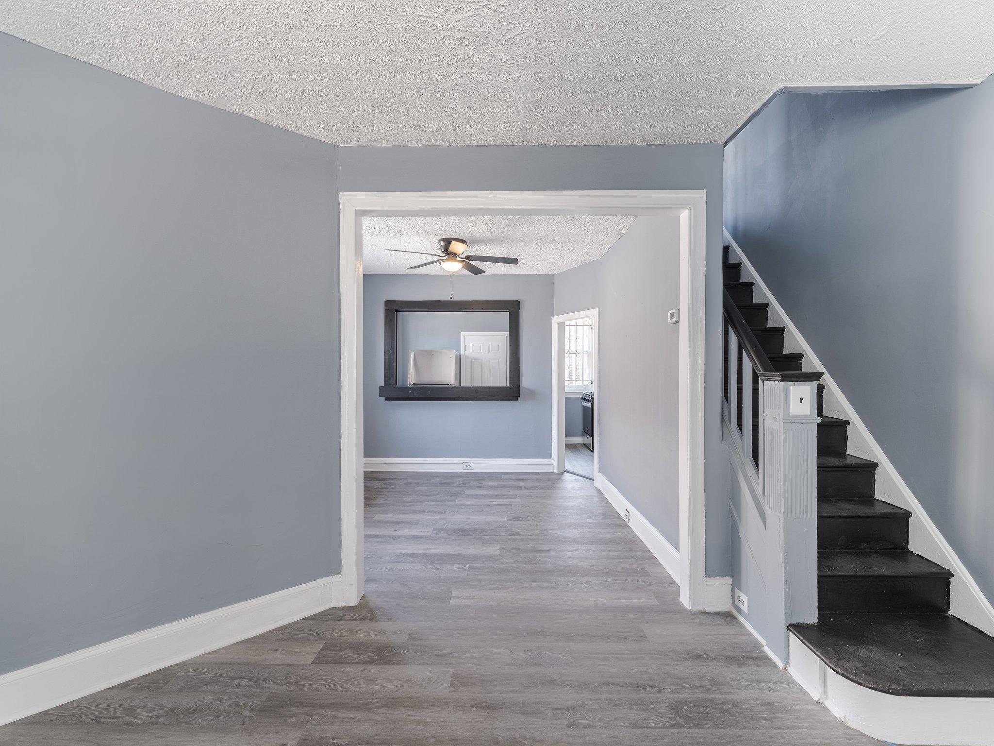 1823 South Yewdall Street Philadelphia, PA 19143 - Photo 4 of 21 Living room with beautiful stairs to 2nd floor.