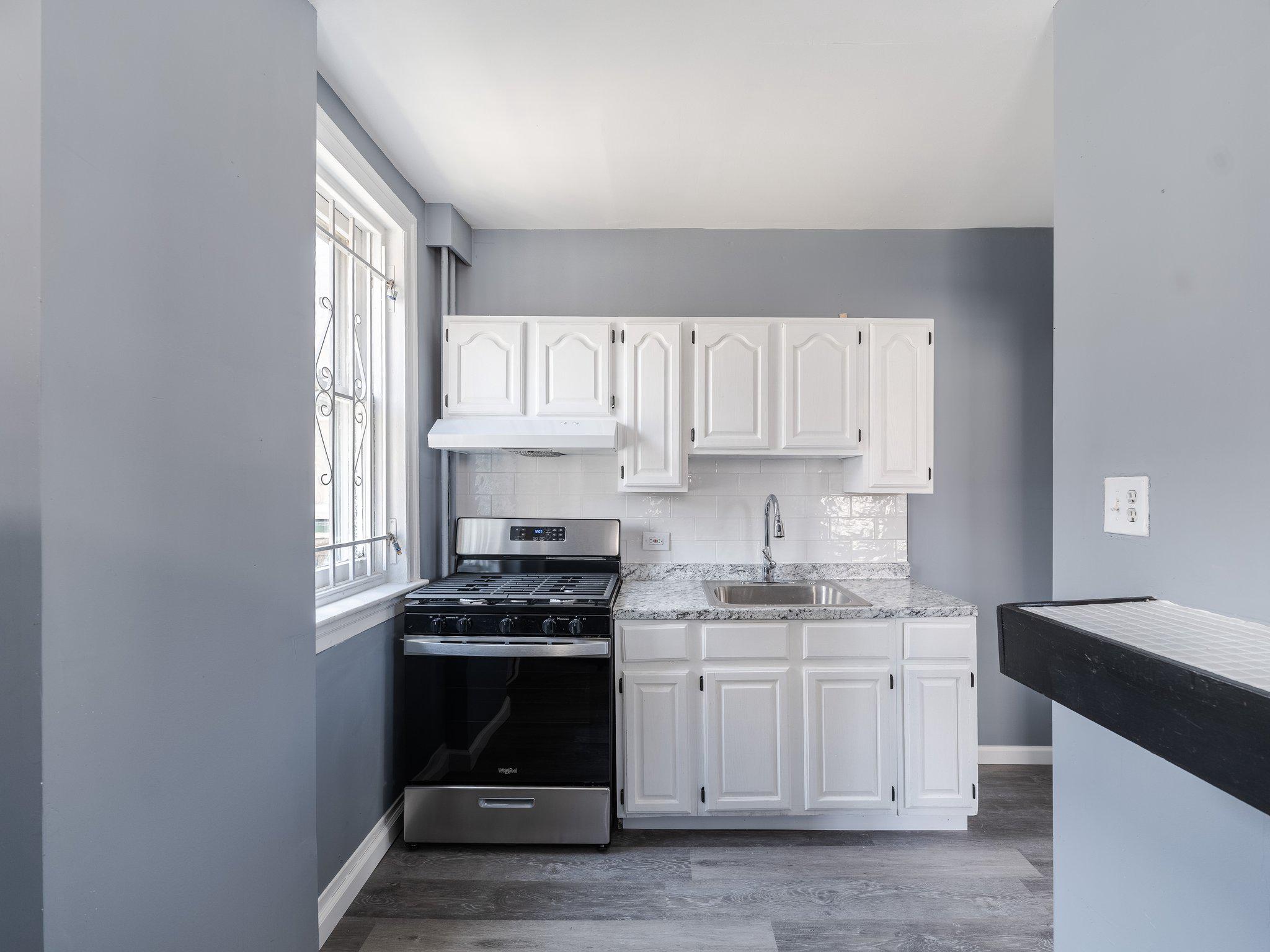 1823 South Yewdall Street Philadelphia, PA 19143 - Photo 9 of 21 Modern kitchen with stainless steel appliances.
