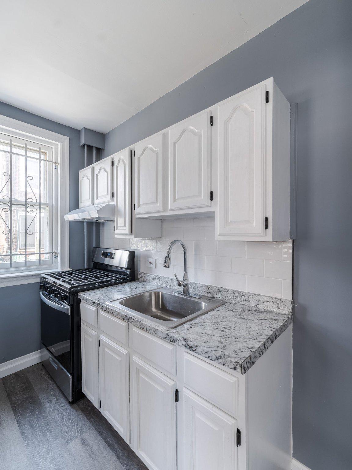 1823 South Yewdall Street Philadelphia, PA 19143 - Photo 10 of 21 Modern kitchen w/ updated cabinets & counter top.