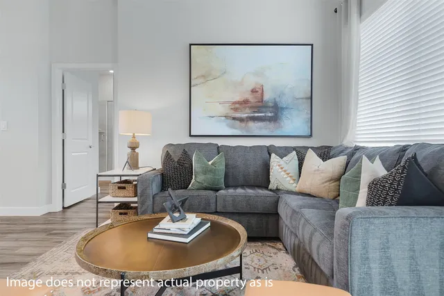 a living room with furniture and a table