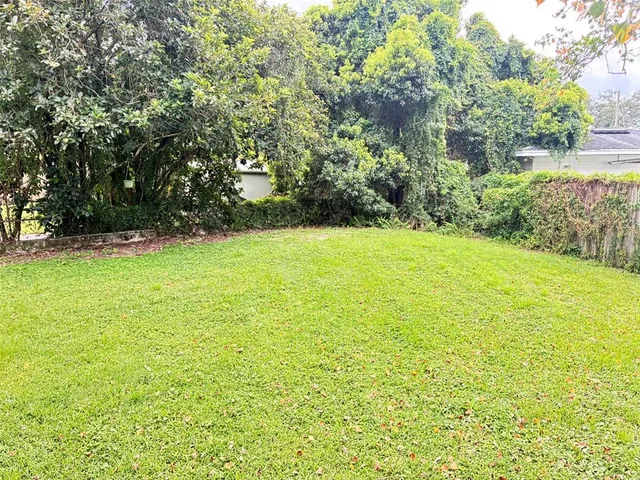a kitchen with white cabinets and a sink