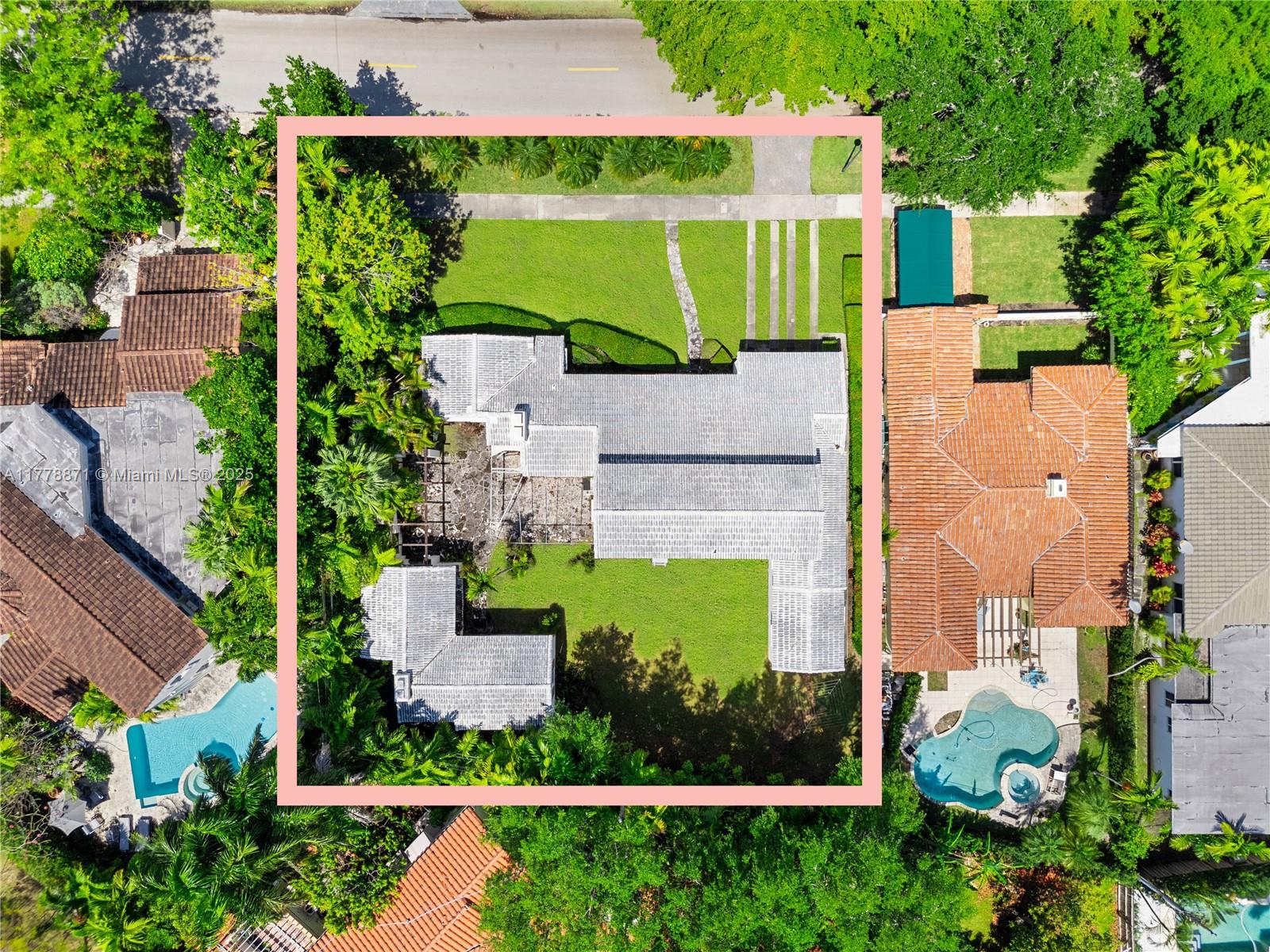 6371 North Bay Road Miami Beach, FL 33141 - Photo 17 of 26 an aerial view of a house with a garden and swimming pool