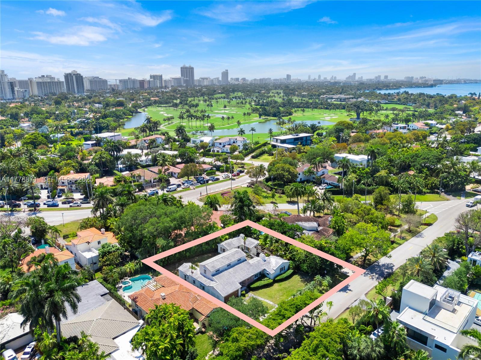 6371 North Bay Road Miami Beach, FL 33141 - Photo 22 of 26 an aerial view of multiple houses with a yard