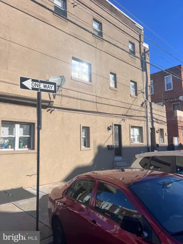 a front view of a house with parking space