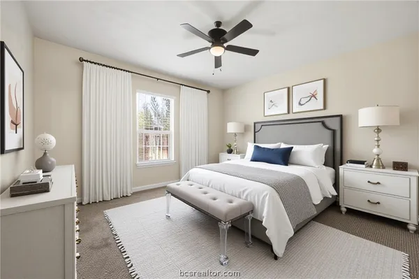 an empty room with ceiling fan and window