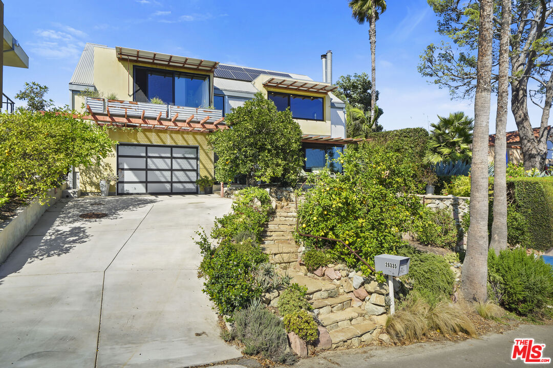 26335 Lockwood Road Malibu, CA 90265 - Photo 1 of 39 a front view of a house with a yard