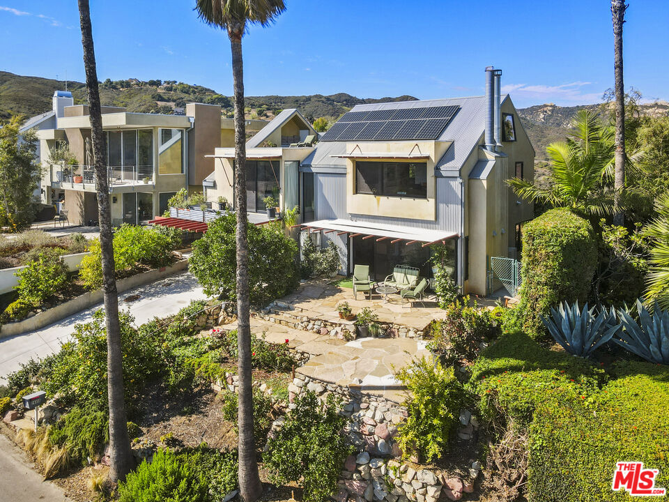 26335 Lockwood Road Malibu, CA 90265 - Photo 2 of 39 a front view of a house with a yard