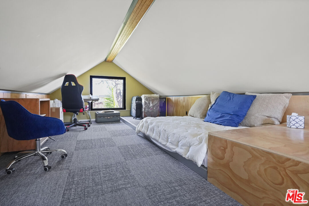 26335 Lockwood Road Malibu, CA 90265 - Photo 24 of 39 a bedroom with a bed a couch and dresser