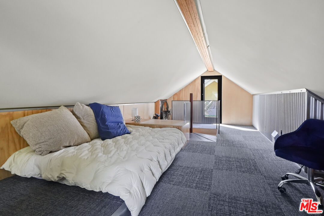 26335 Lockwood Road Malibu, CA 90265 - Photo 25 of 39 a bed room with a bed and a chair