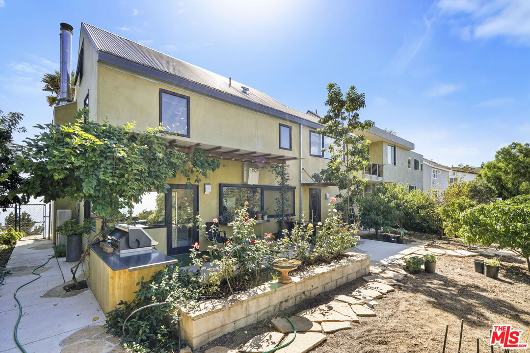 26335 Lockwood Road Malibu, CA 90265 - Photo 36 of 39 a front view of a house with a yard