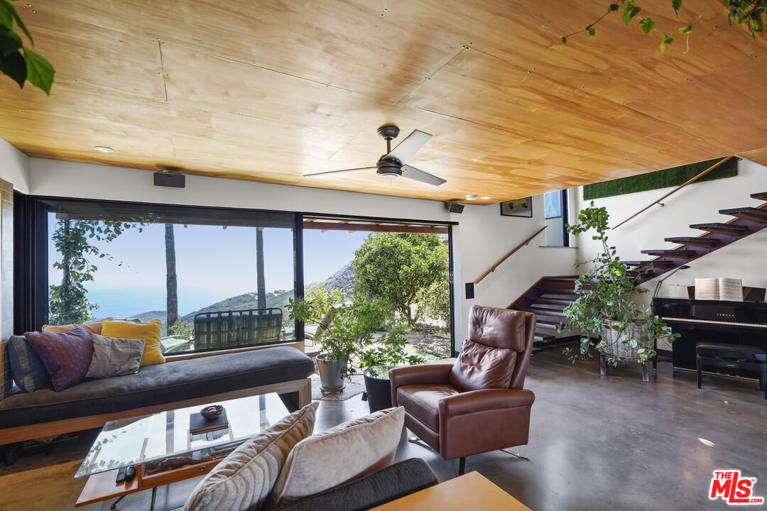 26335 Lockwood Road Malibu, CA 90265 - Photo 4 of 39 a living room with furniture and a large window