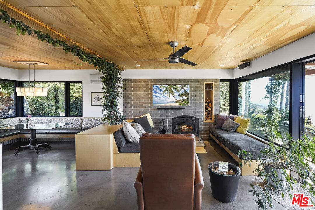 26335 Lockwood Road Malibu, CA 90265 - Photo 6 of 39 a living room with furniture and a large window