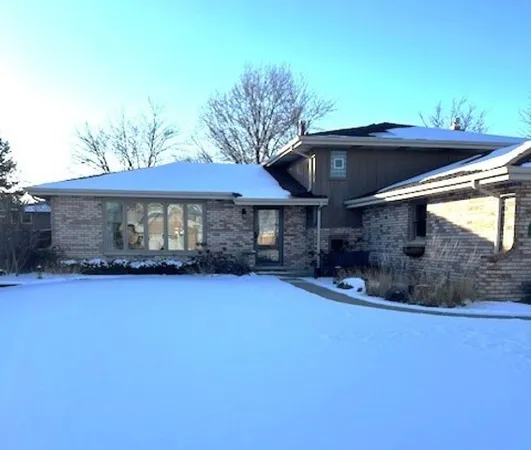 a front view of a house with yard