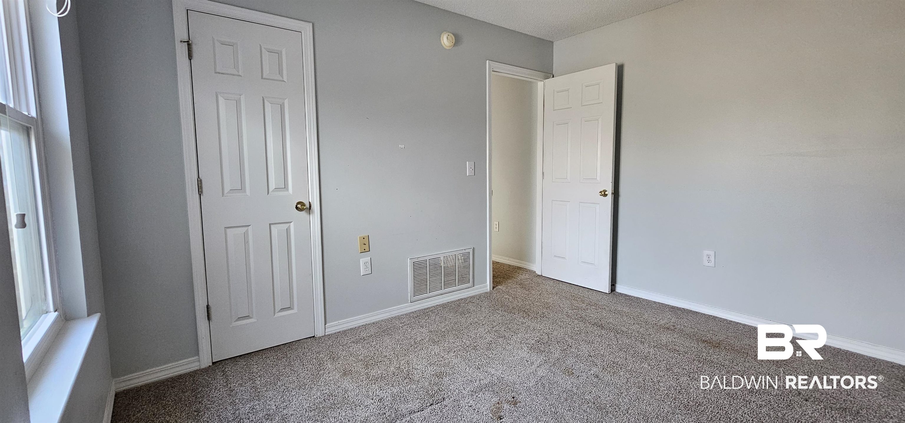 8940 Shannon's Mill Road Foley, AL 36535 - Photo 25 of 35 Unfurnished bedroom with carpet and baseboards