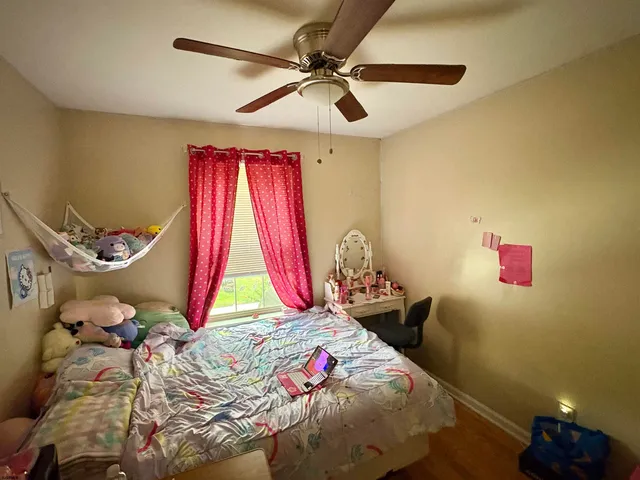 a bed room with a bed and a window