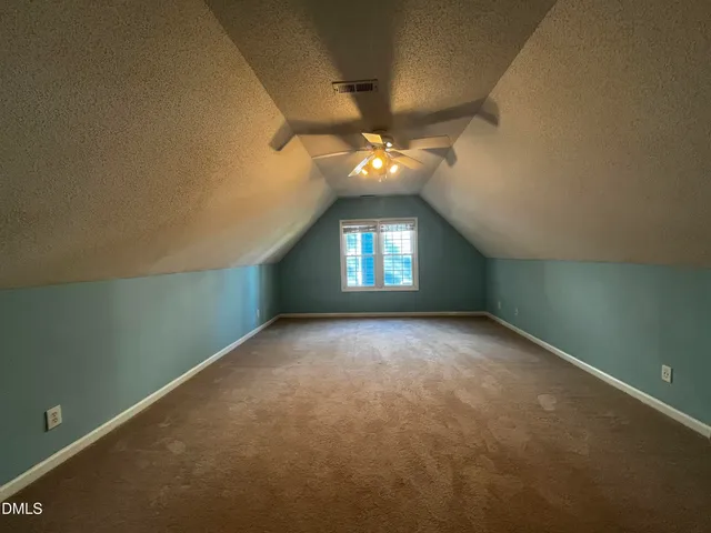 an empty room that has a window in it