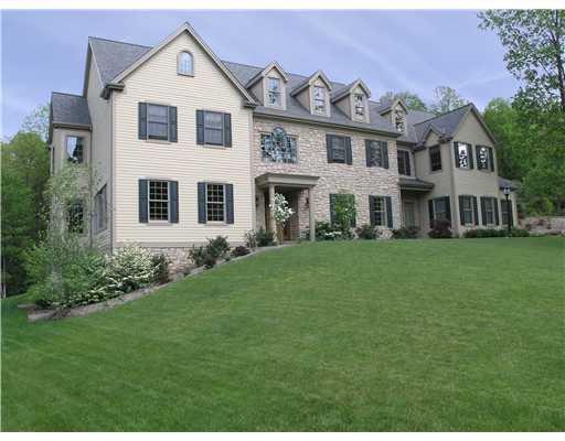 Exterior Front. Exquisitely manicured grounds surround this stunning Bucks County Colonial.