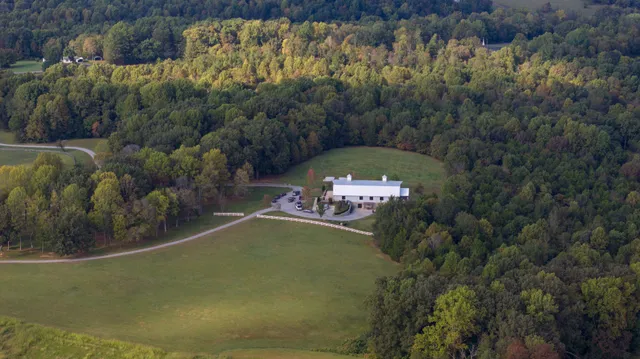 a view of a swimming pool with a yard