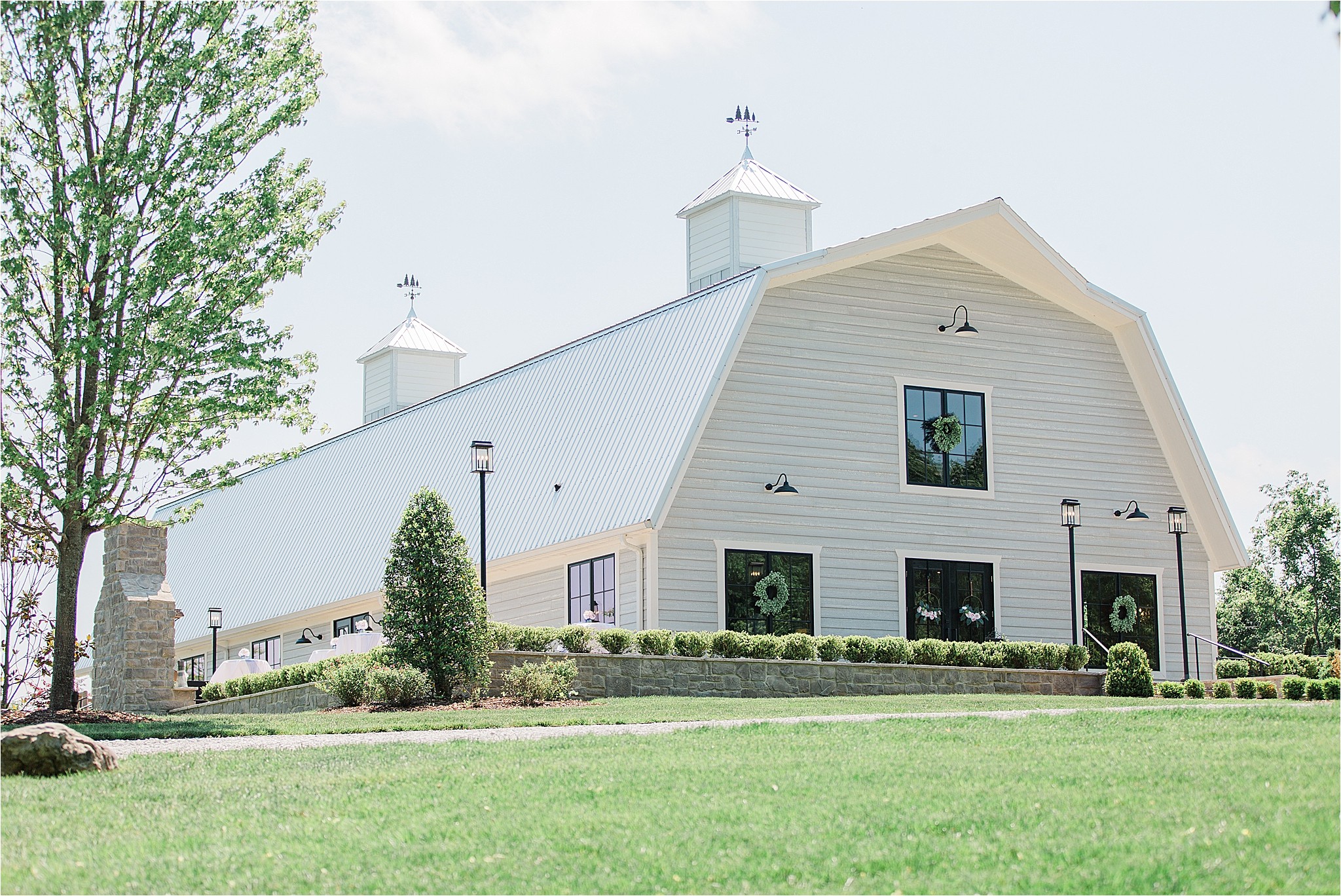 a view of a white house with a yard