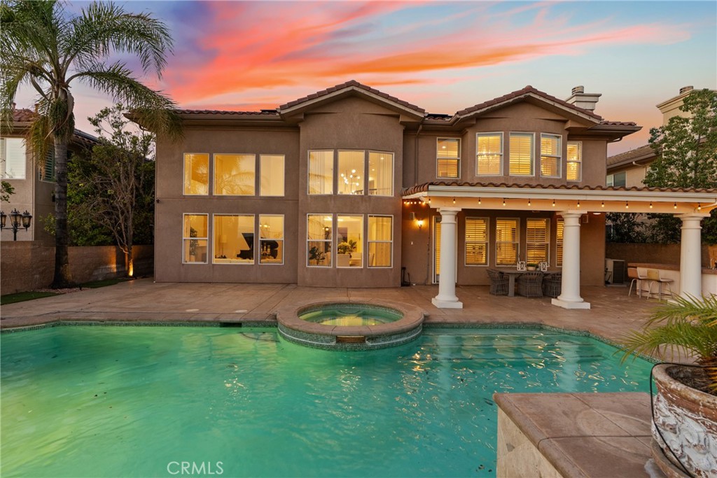 a front view of a house with a yard and porch