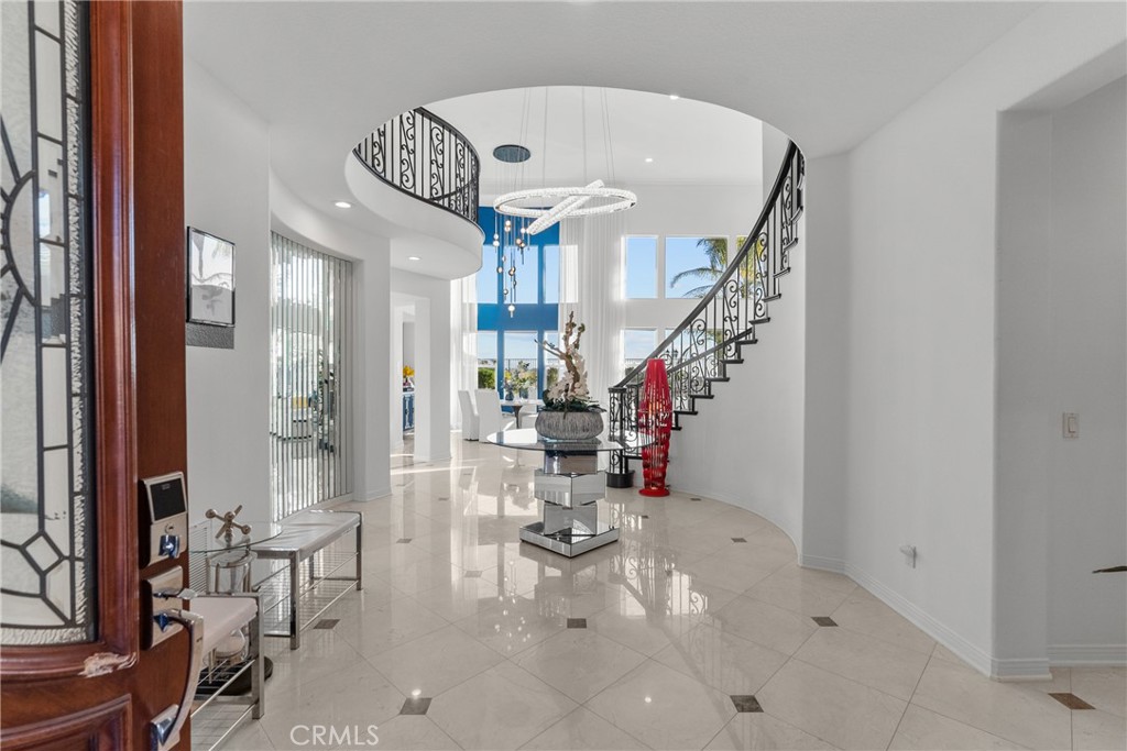 20366 Vía Galileo Porter Ranch, CA 91326 - Photo 19 of 75 a view of entryway and hall with wooden floor