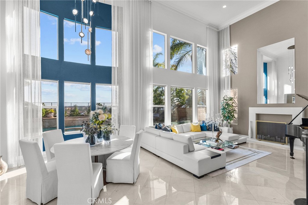 20366 Vía Galileo Porter Ranch, CA 91326 - Photo 22 of 75 a living room with furniture and a large window