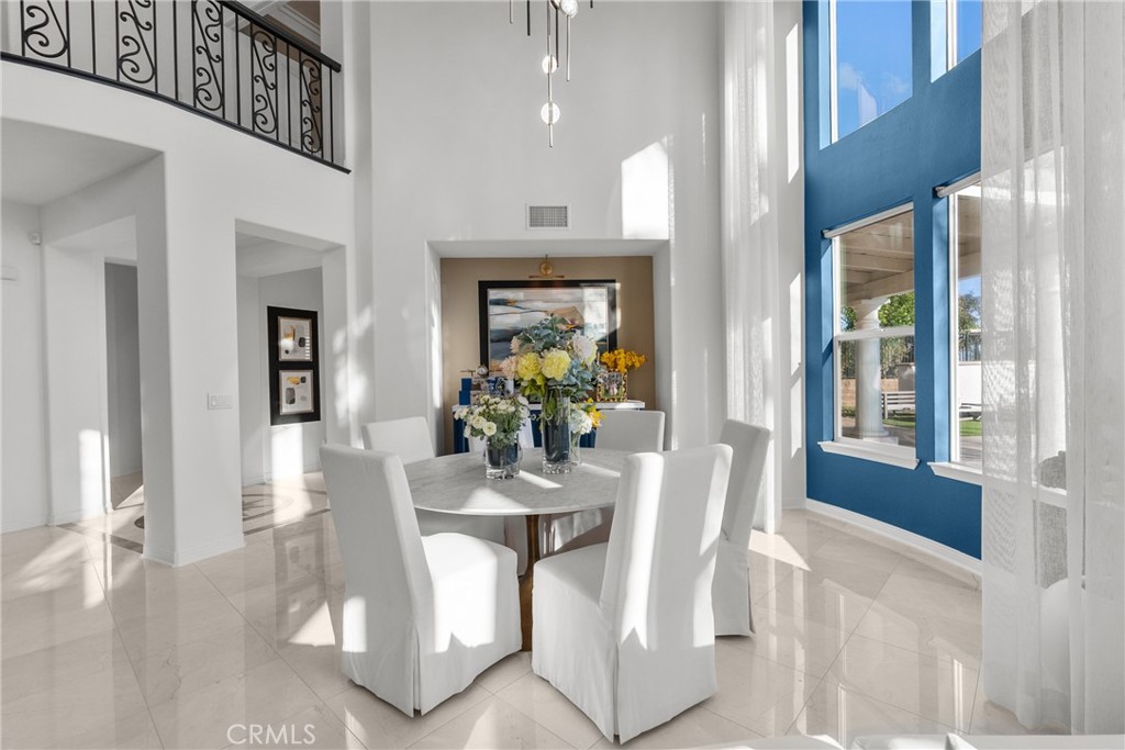 20366 Vía Galileo Porter Ranch, CA 91326 - Photo 25 of 75 a view of a dining room with furniture wooden floor and a chandelier