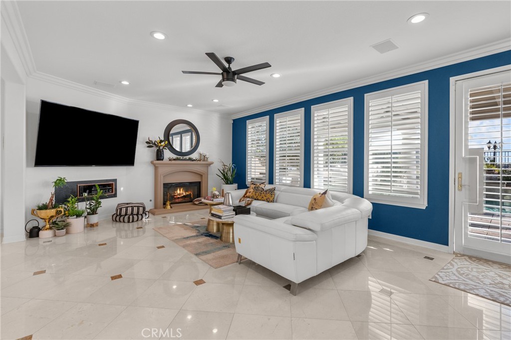 20366 Vía Galileo Porter Ranch, CA 91326 - Photo 29 of 75 a living room with furniture fireplace and a flat screen tv
