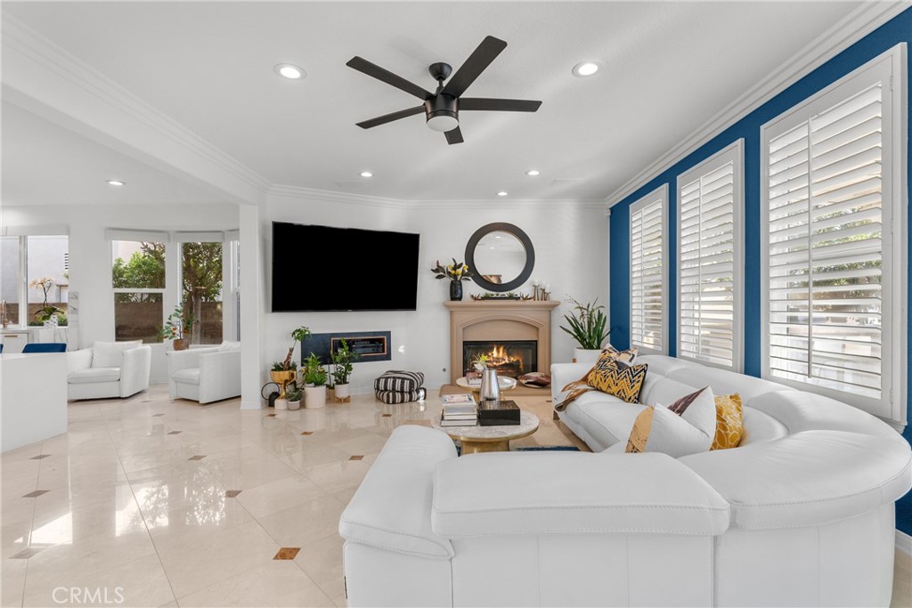 20366 Vía Galileo Porter Ranch, CA 91326 - Photo 30 of 75 a living room with furniture a fireplace and a flat screen tv