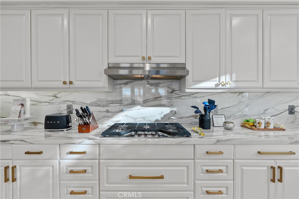 20366 Vía Galileo Porter Ranch, CA 91326 - Photo 39 of 75 a kitchen with appliances cabinets and a counter top space