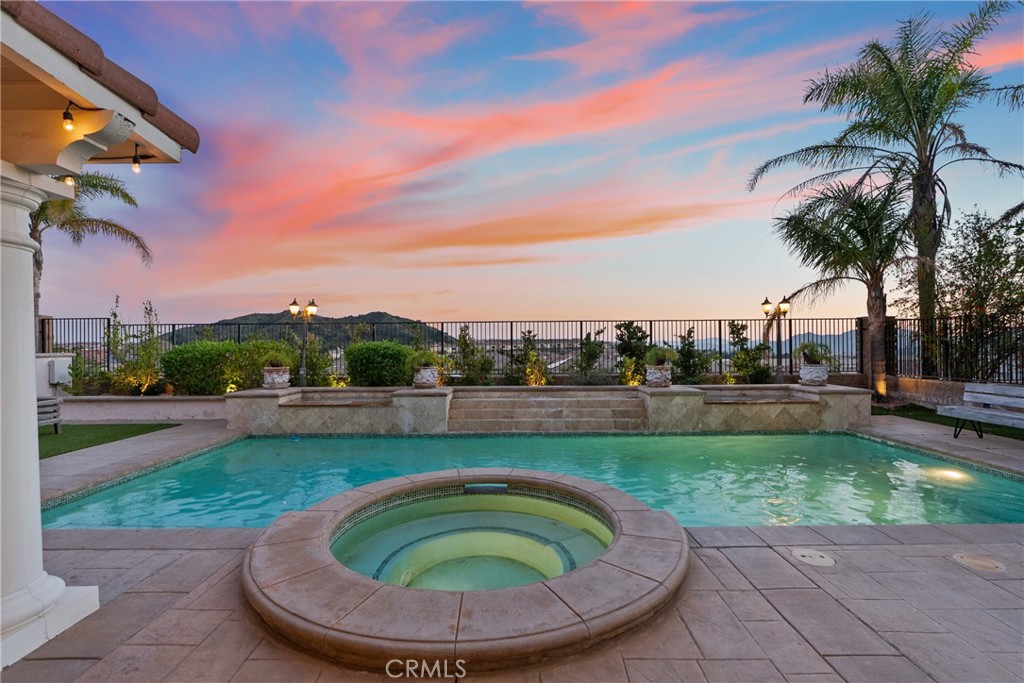 20366 Vía Galileo Porter Ranch, CA 91326 - Photo 4 of 75 a view of a swimming pool with a patio