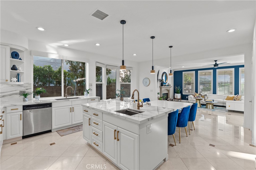 20366 Vía Galileo Porter Ranch, CA 91326 - Photo 41 of 75 a large kitchen with kitchen island a large window in it