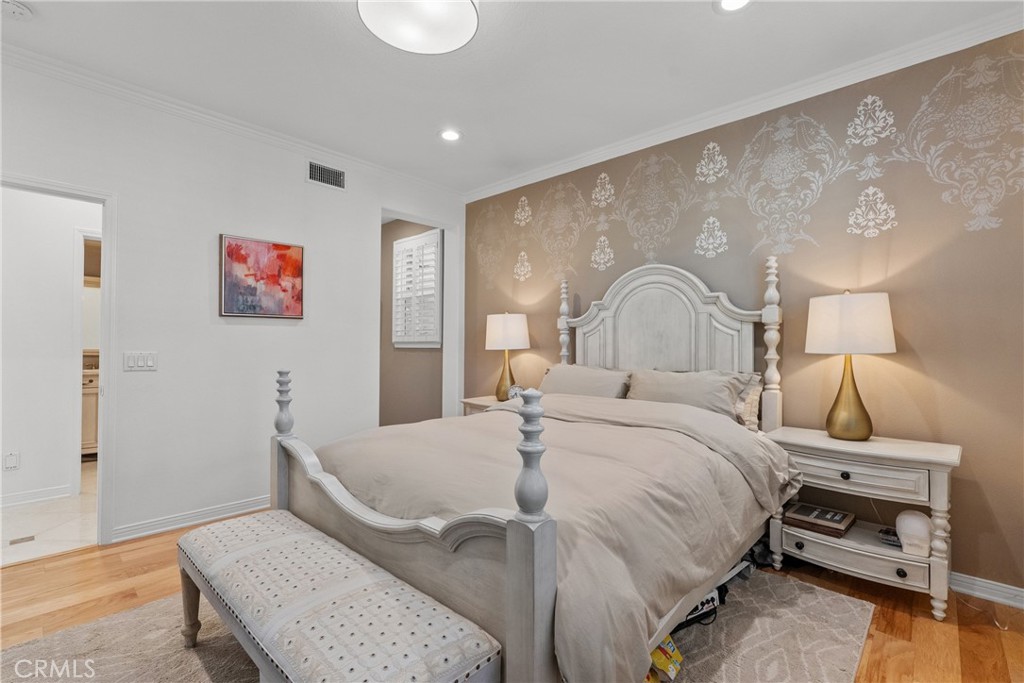 20366 Vía Galileo Porter Ranch, CA 91326 - Photo 47 of 75 a bedroom with a bed and a lamp on table