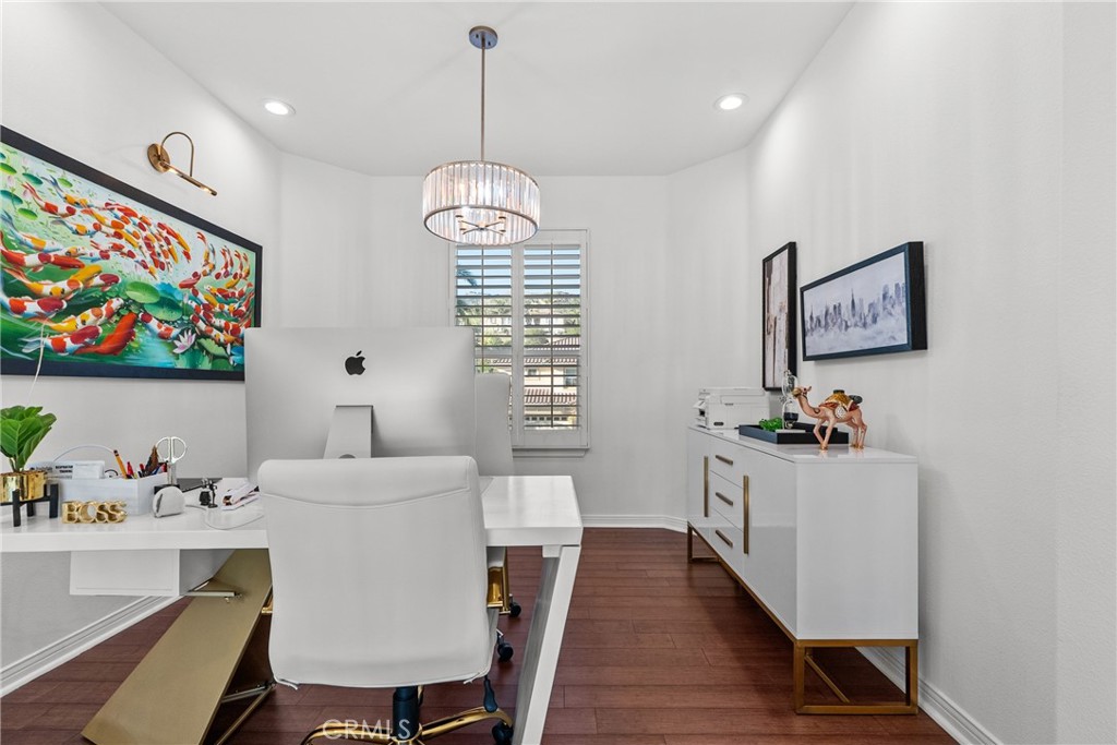 20366 Vía Galileo Porter Ranch, CA 91326 - Photo 55 of 75 a very nice looking dining room with furniture a chandelier and wooden floor