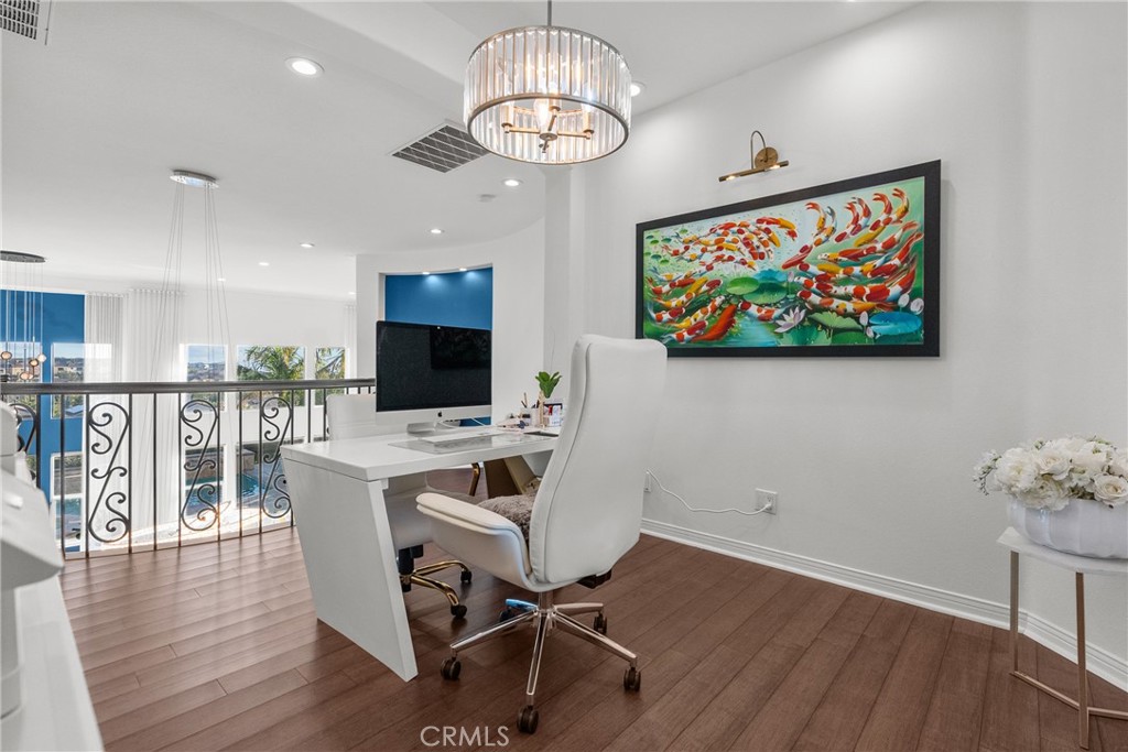 20366 Vía Galileo Porter Ranch, CA 91326 - Photo 57 of 75 a view of a dining room with furniture wooden floor and a chandelier