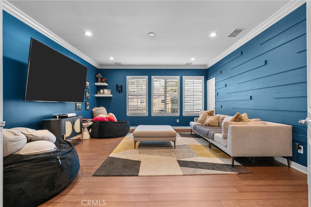 20366 Vía Galileo Porter Ranch, CA 91326 - Photo 62 of 75 a bedroom with furniture and a flat screen tv