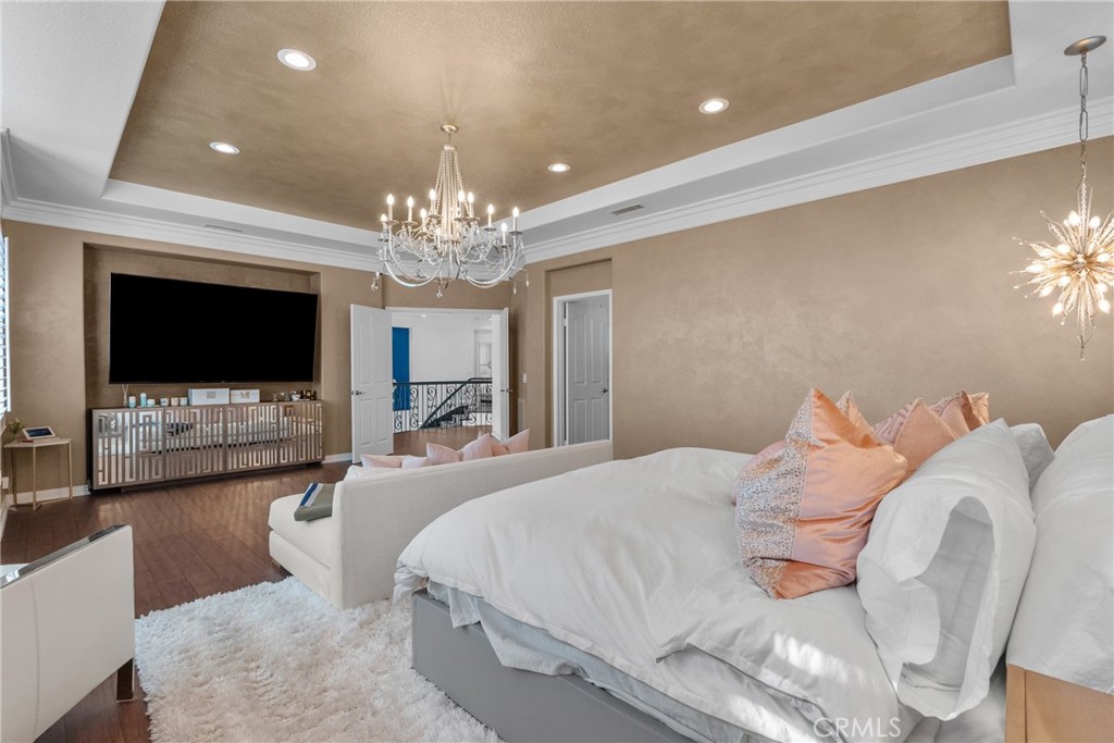 20366 Vía Galileo Porter Ranch, CA 91326 - Photo 68 of 75 a bedroom with a bed and a flat screen tv